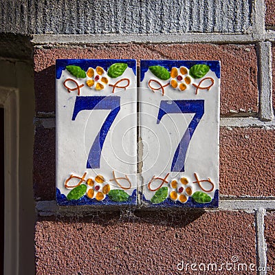 House Number 77 Stock Photo