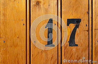 Number 17 on door of storage room for tenants in century-old apartment building in stockholm Stock Photo