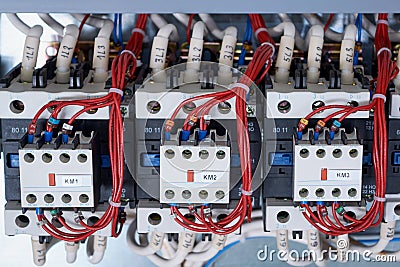 A number of electrical contactors with additional contacts installed on them Stock Photo