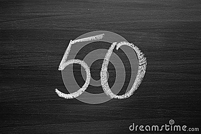 Number fifty enumeration written with a chalk on the blackboard Stock Photo