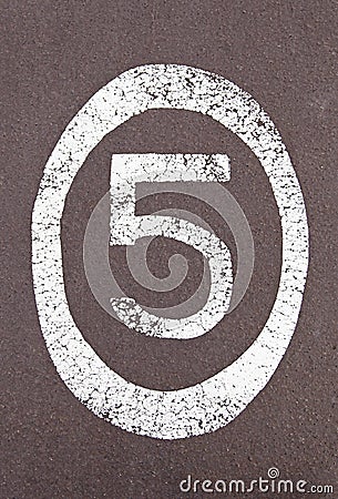 Number five painted on the ground Stock Photo