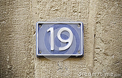 Number nineteen in the wall Stock Photo