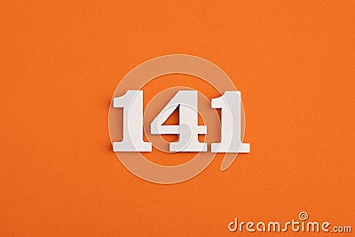 White wooden number 141 on eva rubber orange background Stock Photo