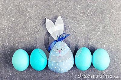 A number of painted eggs, including two handmade Easter bunny, blue and pink Stock Photo