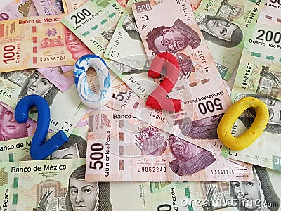 number 2020 in plasticine colors, on mexican banknotes of various denominations Stock Photo