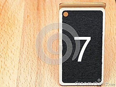 number seven black and white with wooden background Stock Photo