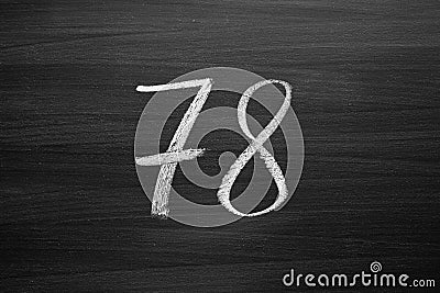 Number seventy eight enumeration written with a chalk on the blackboard Stock Photo