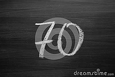 Number seventy enumeration written with a chalk on the blackboard Stock Photo