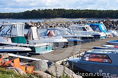 A number of small boats moored in the small harbor on the Baltic sea Stock Photo