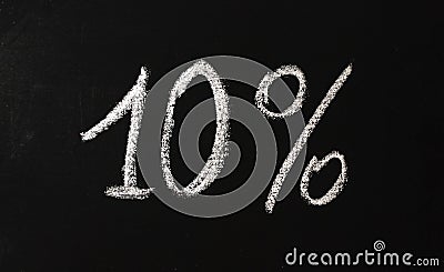 Number ten percent written in white chalk on a black chalkboard. 10 Stock Photo