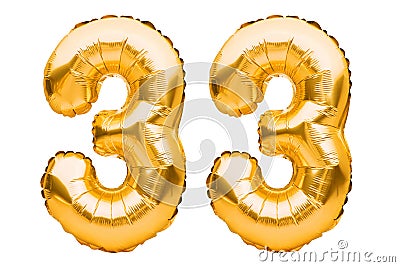 Number 33 thirty three made of golden inflatable balloons isolated on white. Helium balloons, gold foil numbers. Party decoration Stock Photo