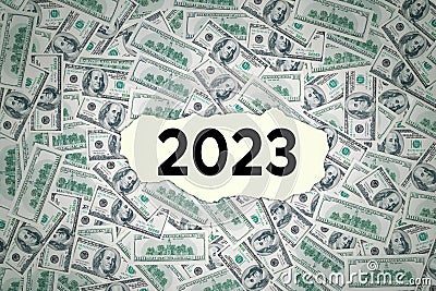 2023 number on torn paper with money background Stock Photo