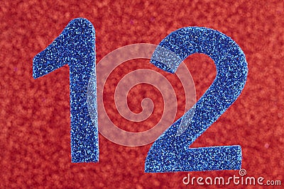 Number twelve blue color over a red background. Anniversary. Stock Photo