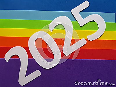 number 2025 in white with foamy in rainbow colors background Stock Photo