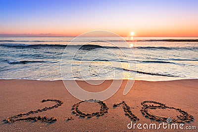 Number 2018 written on seashore san. Stock Photo