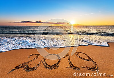 Number 2019 written on seashore sand at sunrise. Stock Photo