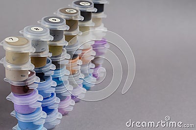 Numbered Plastic paint containers on Gainsboro color background Stock Photo