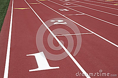 Numbered running lanes on a track Stock Photo