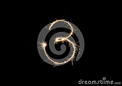 Numbers 3 or three Sparkler firework light isolated on black background Stock Photo