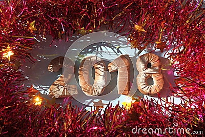 Numbers in velour fabric. the new year 2018. red tinsel. Stock Photo