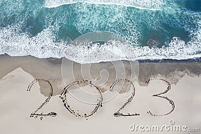 2023 numbers written on the sand of coastline Stock Photo