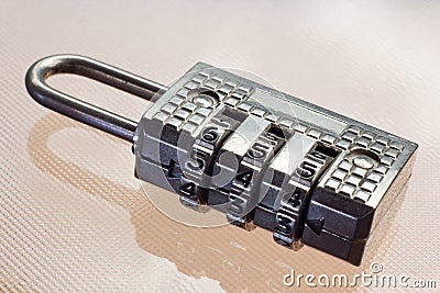 Numeric Password Lock Closeup Over a Shiny Surface Stock Photo