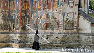 Nun at Moldovita Monastery in Vatra Moldovitei, Romania Editorial Stock Photo