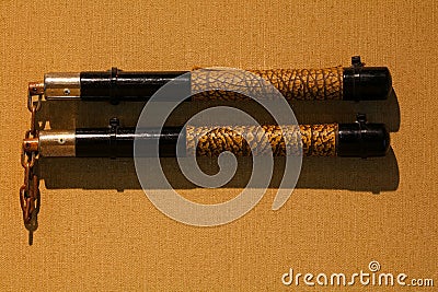 Nunchaku or nunchucks on the wall on display Stock Photo