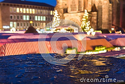 Nuremberg, Germany-Christmas Market in rain- blurred evening scenery Stock Photo