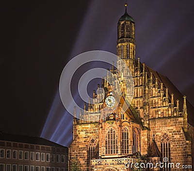 Nuremberg night, laser light at church Stock Photo