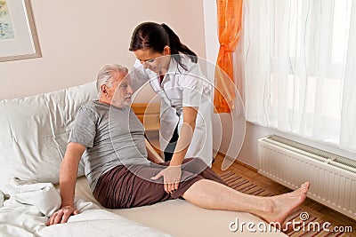 Nurse in aged care for the elderly Stock Photo