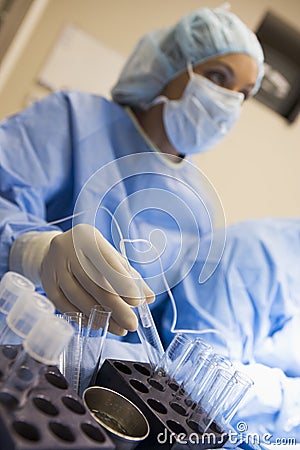 Nurse assisting with egg retrieval procedure Stock Photo