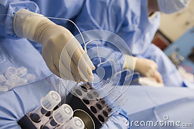 Nurse assisting with egg retrieval procedure Stock Photo