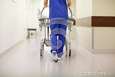 Nurse carrying hospital gurney to emergency room Stock Photo