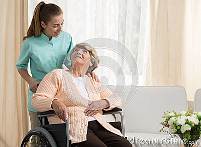 Nurse discussing with elder patient Stock Photo