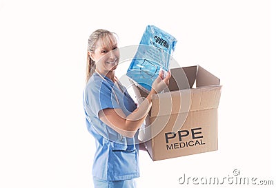 Nurse or doctor holding a Category 3 Coverall PPE for infection control Stock Photo