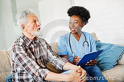 nurse doctor senior care caregiver help assistence retirement home nursing elderly man woman health support african Stock Photo
