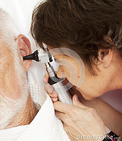 Nurse or Doctor Using Otoscope Stock Photo