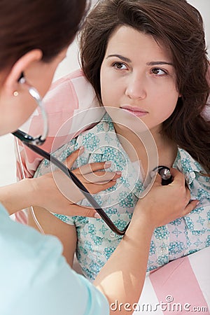 A nurse examines a young girl Stock Photo