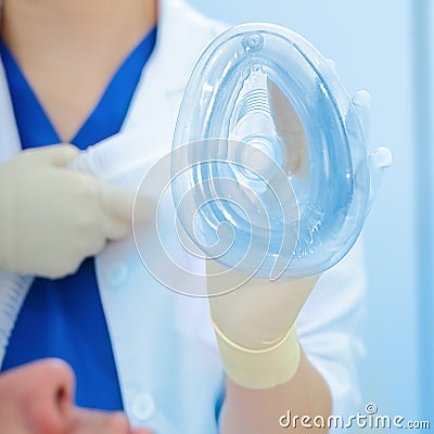 Nurse giving the patient a breathing mask Stock Photo