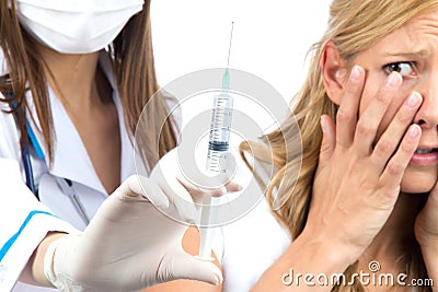 Nurse hand with syringe needle fear of injections Stock Photo