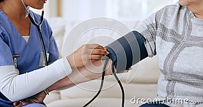 Nurse hands, home and blood pressure test for healthcare service, support and caregiver for medical monitor. ADN worker Stock Photo