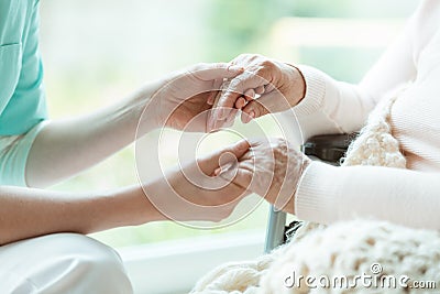 Nurse holding patient`s hands Stock Photo