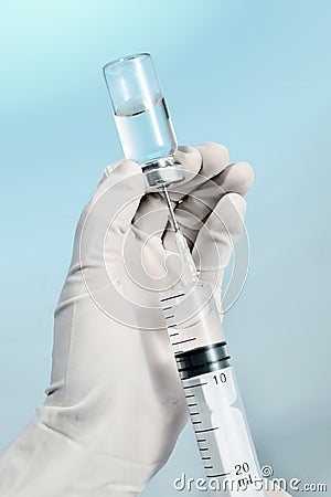 Nurse holding a syringe for injection Stock Photo