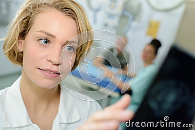 Nurse inspecting first hand xray result Stock Photo