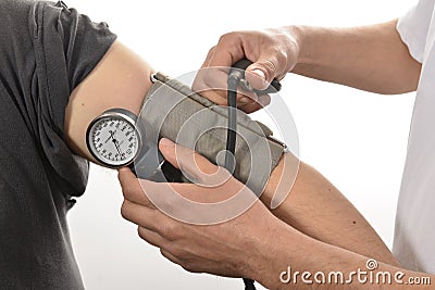 Nurse monitoring blood pressure Stock Photo