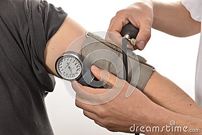 Nurse monitoring blood pressure Stock Photo