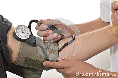 Nurse monitoring blood pressure Stock Photo