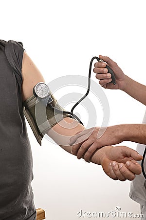 Nurse monitoring blood pressure Stock Photo