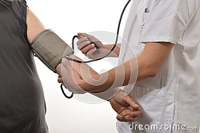 Nurse monitoring blood pressure Stock Photo